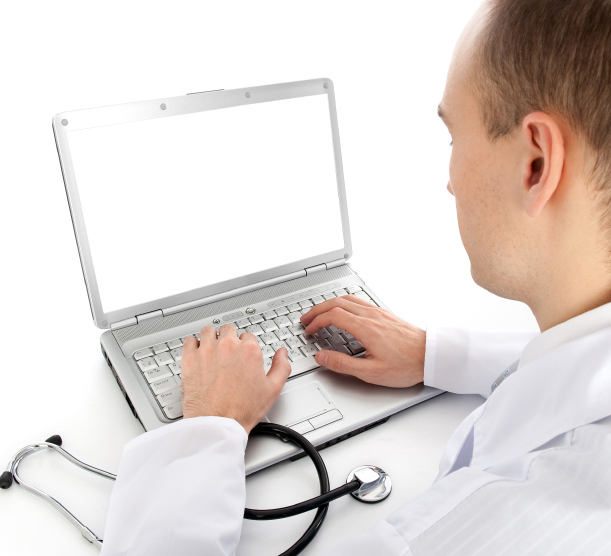 Healthcare professional completing a writable PDF form on his computer
